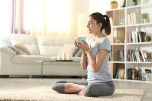 Yogi drinking tea after yoga exercises