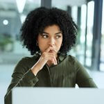 Shot of a young businesswoman looking thoughtful