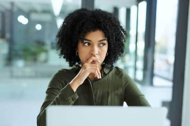 Shot of a young businesswoman looking thoughtful